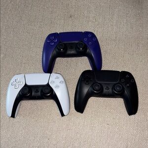 Black, White, & Purple PS5 Controllers